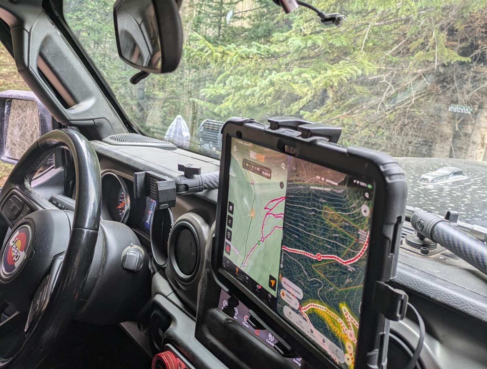 The iPad on Sucia's dash, Trails Offroad and OnX side by side