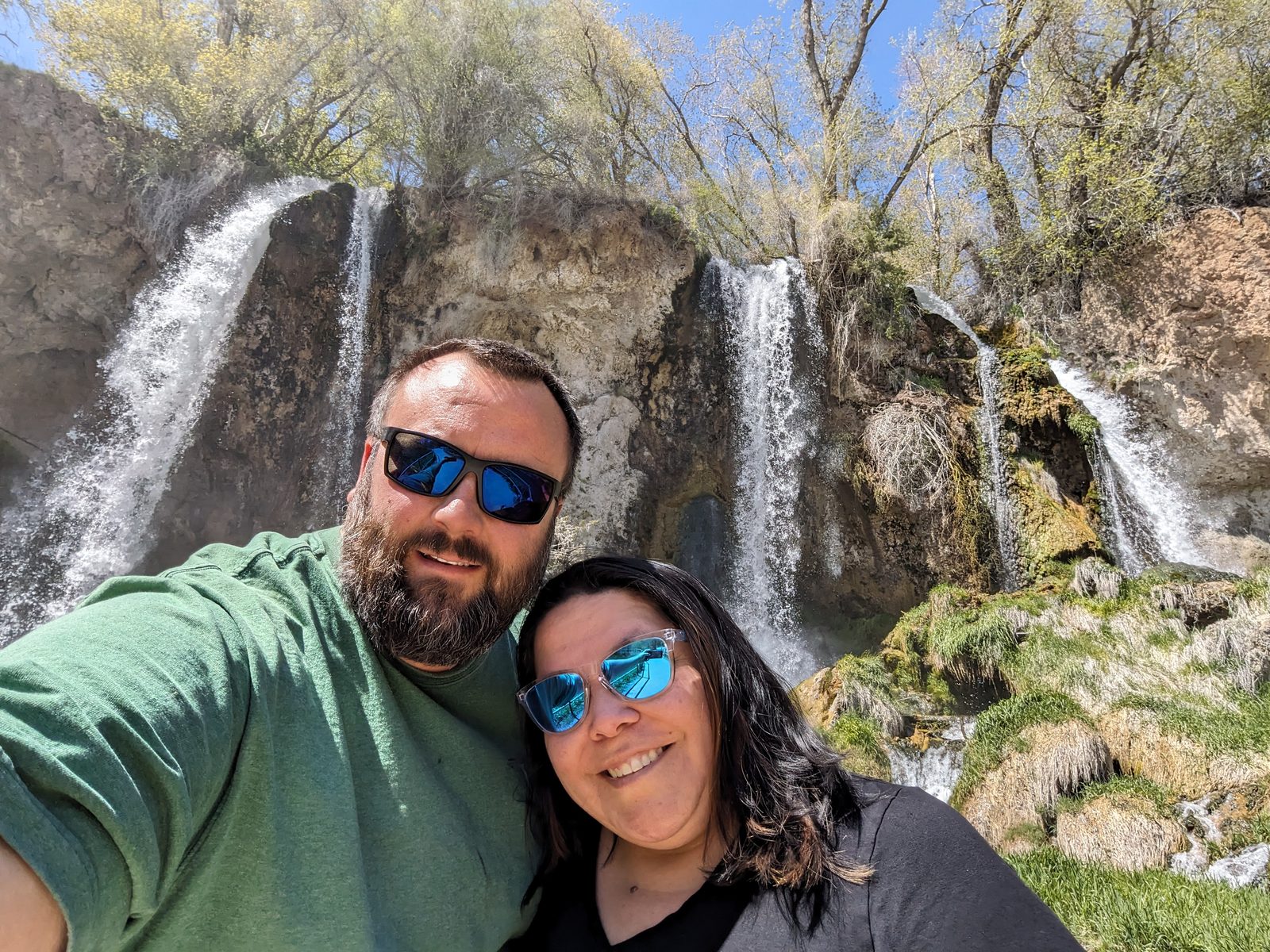 Dan and Drea in sunglasses in front of Rifle Falls